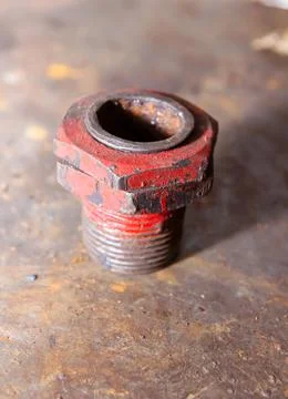 Old rusty bolt and nut on steel background Photos