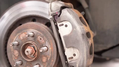 Old rusty brake disc close-up. a rusty hub of a car wheel Stock Footage 240334878