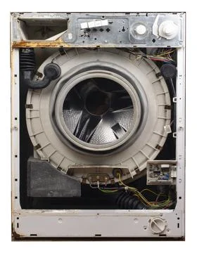 Old rusty broken washing machine without front wall Stock Photos
