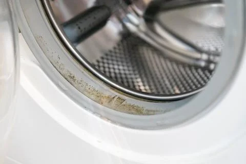 Old rusty broken washing machine isolated on white background. Stock Photos
