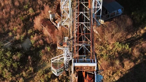 Old Rusty Bucket Wheel Excavator On Shore Of Lake Video stock 303698615