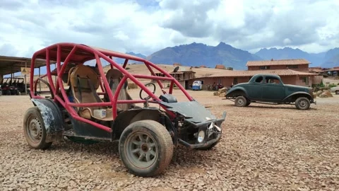 Old rusty buggy and car at a touristic site near Cusco, Peru 動画素材 288380547