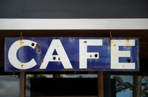 Old rusty cafe sign Stock Photos
