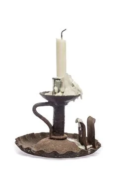 Old rusty candlestick with blasted candle Stock Photos