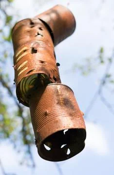 Old rusty cans as a hanging target Stock Photos