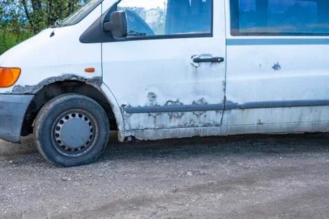 An old rusty car is on the ground Stock Photos