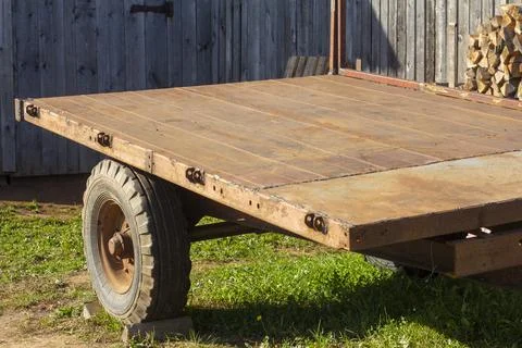 An old rusty cargo trailer stands still. Stock Photos