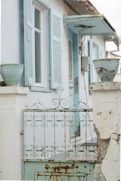 Old rusty cast iron gate and entry of the house Stock Photos
