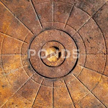 Photograph: An old rusty cast-iron surface with a relief pattern #156223647