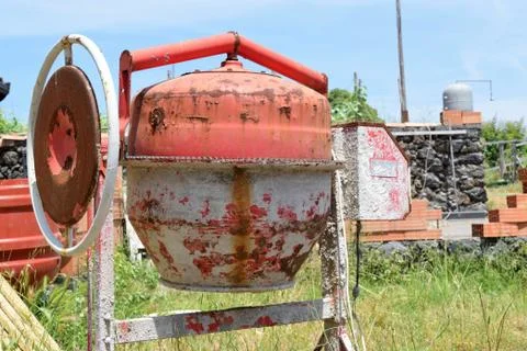 Old rusty cement mixer on construction site Stock Photos