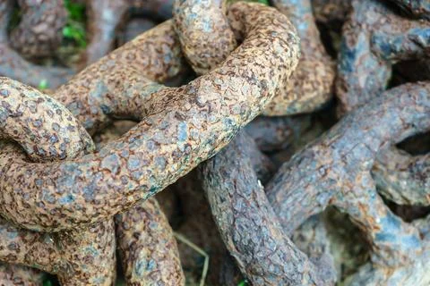 Old rusty chain lies close-up Stock Photos