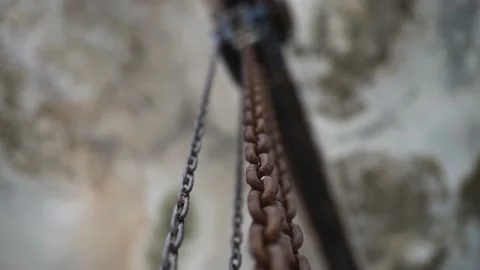 Old rusty chain showing each link pulled taut. Concept of strength, security, or Stock Footage 146536218