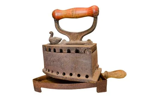 Old rusty charcoal flat iron on stand Stock Photos