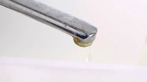 Old rusty chrome faucet with dripping water drops. Leaky tap with limescale. 스톡 동영상 188047257