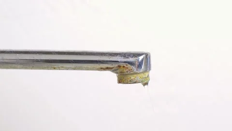 Old rusty chrome faucet with dripping water. A leaky water tap, plumbing leak. Stock Footage 188047310