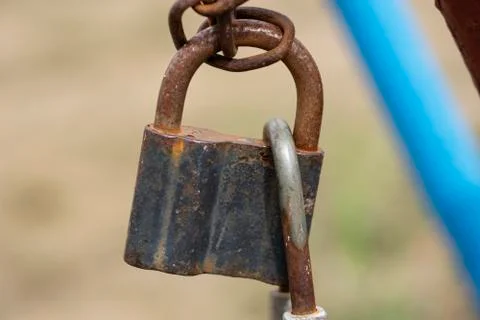 Old rusty closed lock on a chain Stock Photos