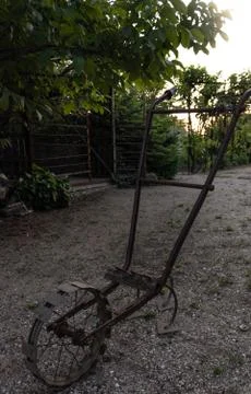 Old rusty device for manual plowing and cultivating the countryside Stock Photos