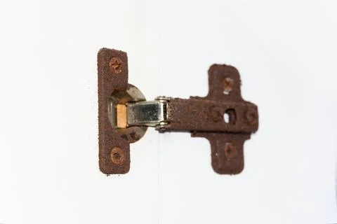 Old rusty door hinge, cabinet hinges, outdated bathroom hinge covered in rust Foto stock