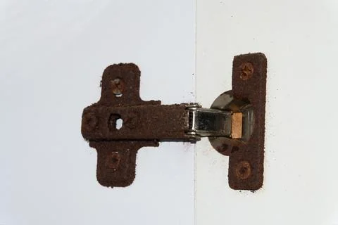 Old rusty door hinge, cabinet hinges, outdated bathroom hinge covered in rust 스톡 사진