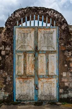 Old rusty door with pad locks and rock arch at historical palace of the Fon Stock Photos
