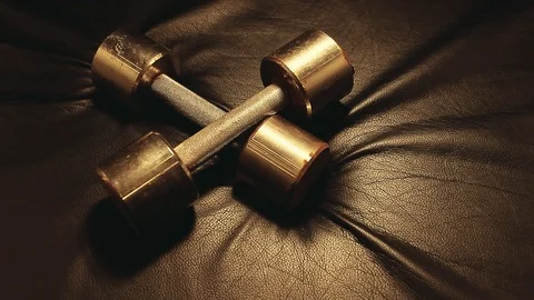 Old rusty dumbbell leather background hd footage Stock Footage 119169361
