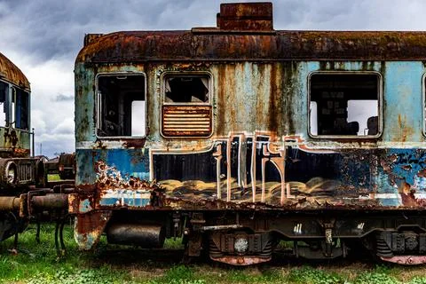 Old rusty electric multiple units abandoned on unused railway tracks Fotos Stock