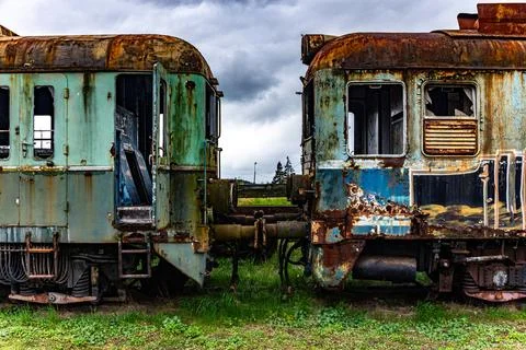 Old rusty electric multiple units abandoned on unused railway tracks Фото