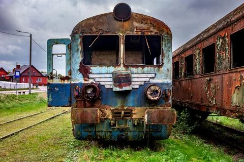Old rusty electric train abandoned on unused siding Stock Photos