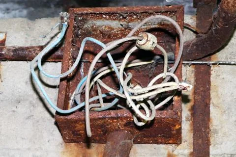 Old rusty electrical panel. Rotten wire Stock Photos