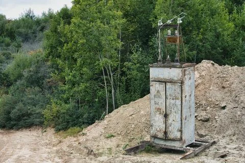Old Rusty Electrical Transformer Substation Cabinet in Outdoor Field Stock Photos