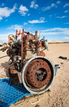 Old rusty engine in a Mojave desert junkyard Stock Photos