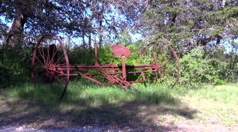 Old rusty farm equipment maybe pulled by horses Stock Footage 48984363
