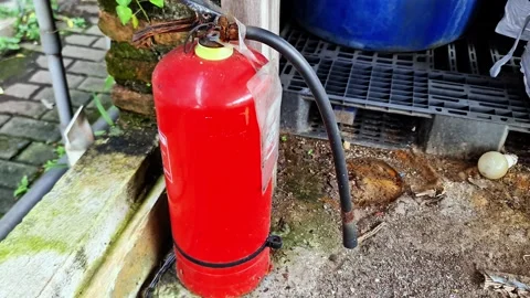 Old Rusty Fire Extinguisher with Damaged Handle in Abandoned Outdoor Area Video stock 331712669