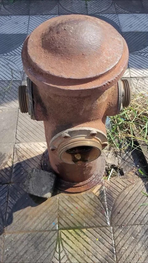 Old, rusty fire hydrant on a city sidewalk Stock Footage 336826703