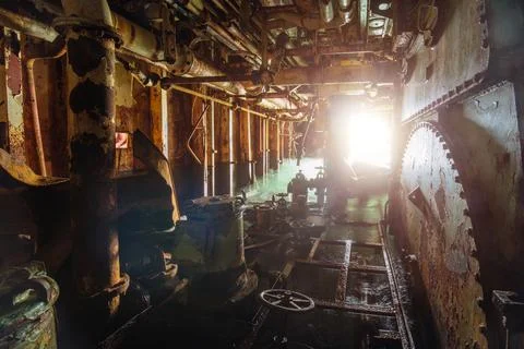 Old rusty flooded abandoned ship engine room 스톡 사진