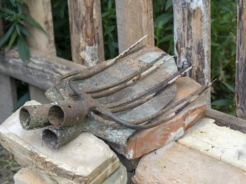 Old rusty fork tips and shovels. Tools for agriculture Stock Photos