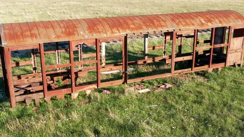 Old rusty freight car- covered railway wagon for transportation of goods Stock Footage 153814117