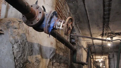 Old rusty gas control valve on the wall. Industrial valve in a large system.  Stock Footage 88988062