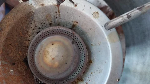 Old rusty gas stove Stockbeeldmateriaal 263169954