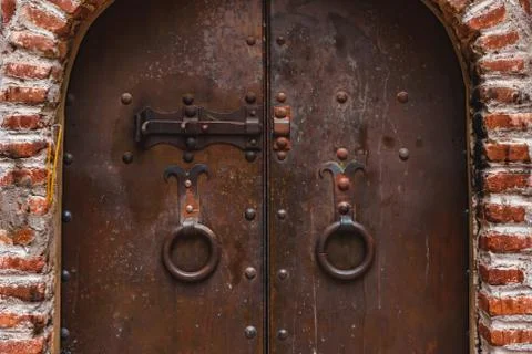 Old rusty gate of the ancient monastery in Georgia Stock Photos