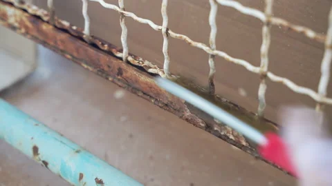 Old rusty gate on construction site, workman in gloves using handheld metal Stock-Footage 208441189