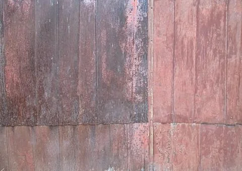 Old rusty gate. Retro cover texture. Photo background of an abandoned object. Photos