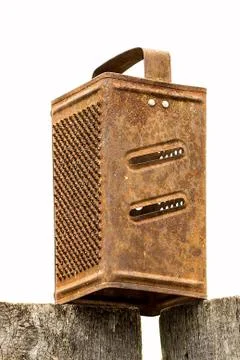Old rusty grater on a white background Stock Photos
