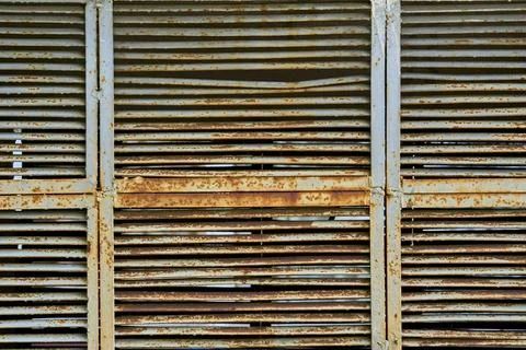 Old rusty gray grille ventilation holes lattice Stock Photos