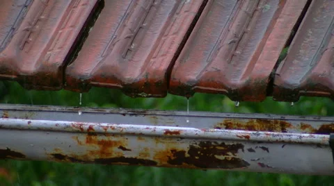 Old rusty gutter and roofing tile on heavy rain Stock Footage 56383176