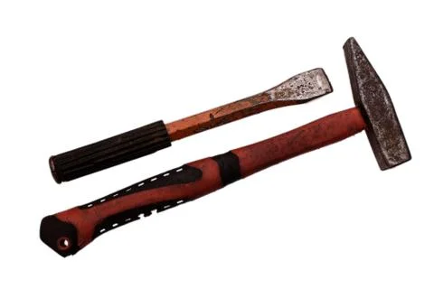 Old rusty hammer and chisel isolated on white background Stock Photos