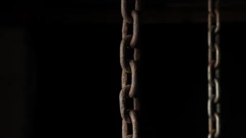 Old rusty hanging chains on a black background Stock Footage 197525124