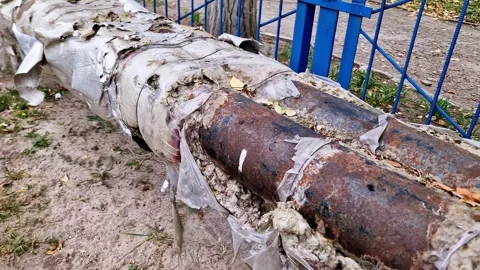 Old Rusty Heating Pipes with Damaged Insulation Outdoors Stock Footage 325218735