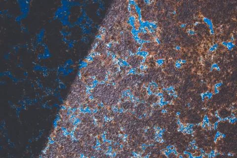 On old rusty iron peeling, blue dried paint Stock Photos