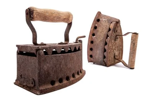 Old rusty iron on a white background. Ironing. Stock-Fotos